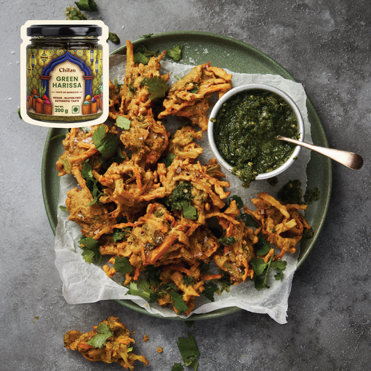  Green Harissa fritters (pakoda) served with a side dip of Chilzo's Green Harissa. 