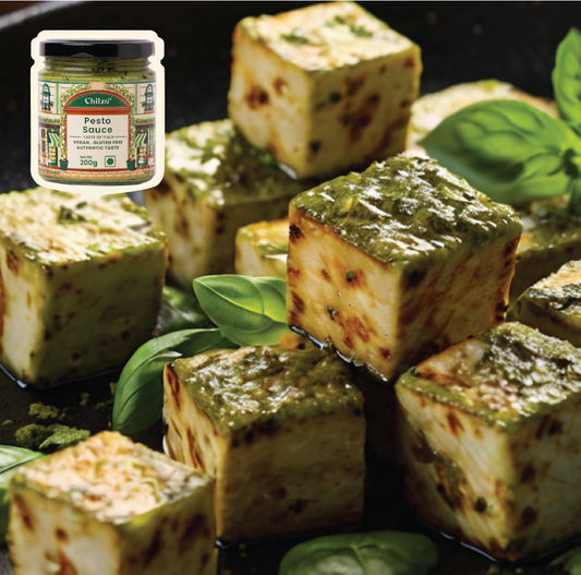 Paneer cubes coated in Chilzo's authentic pesto, topped with Parmesan and fresh basil, served with crusty baguette slices.